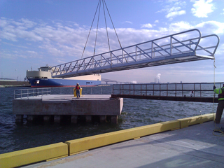 Aluminum gangway from shore to dolphin.