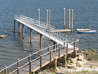 Aluminum pier and gangway system in Rhode Island. The pier is supported by fiberglass pilings.